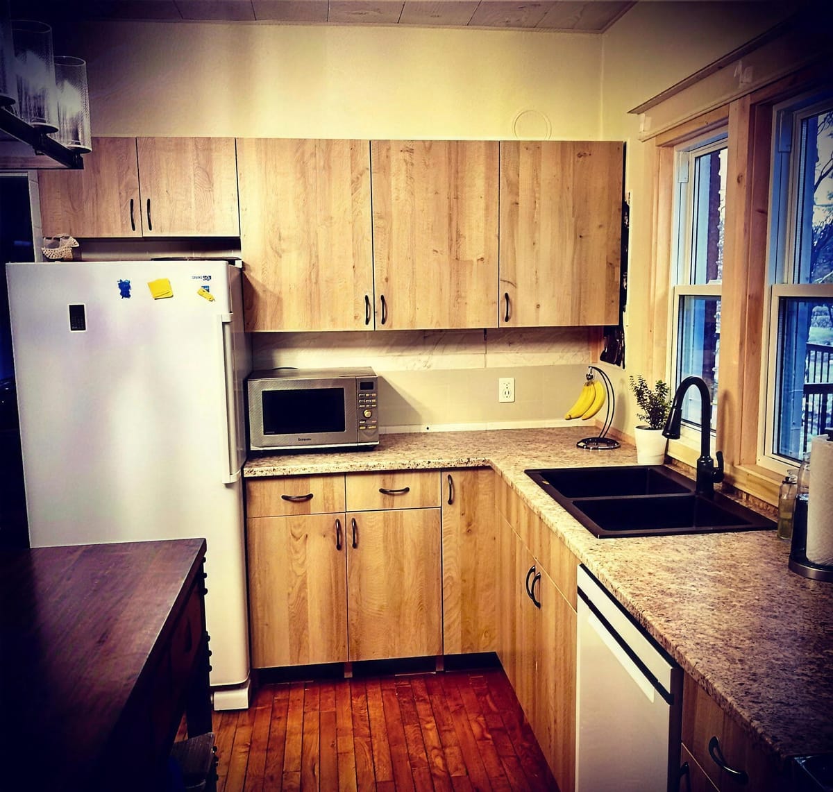A few new cabinets, a new sink and a new home for the dishwasher helps transform this kitchen just a little bit.